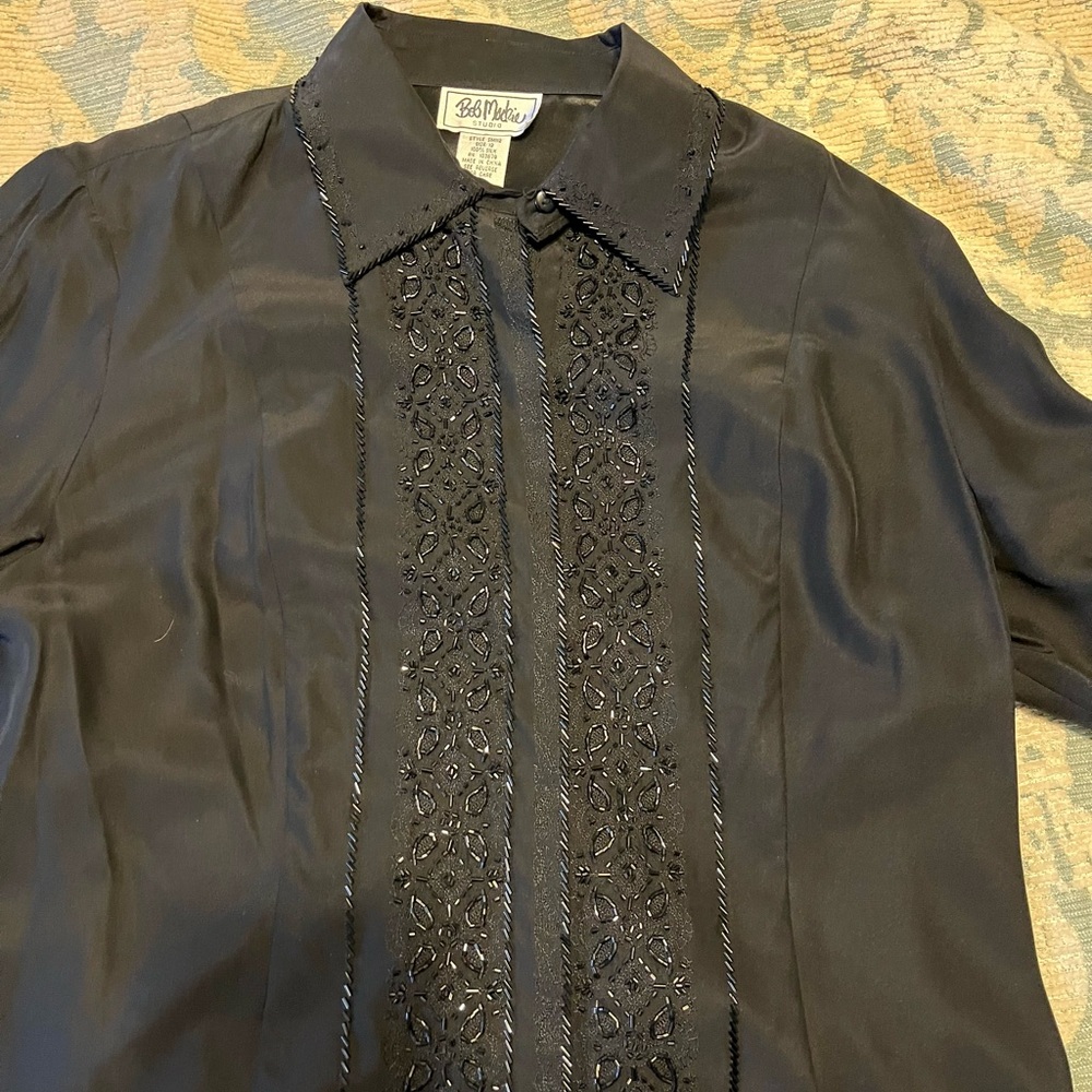 Black beaded blouse by Bob Mackie.